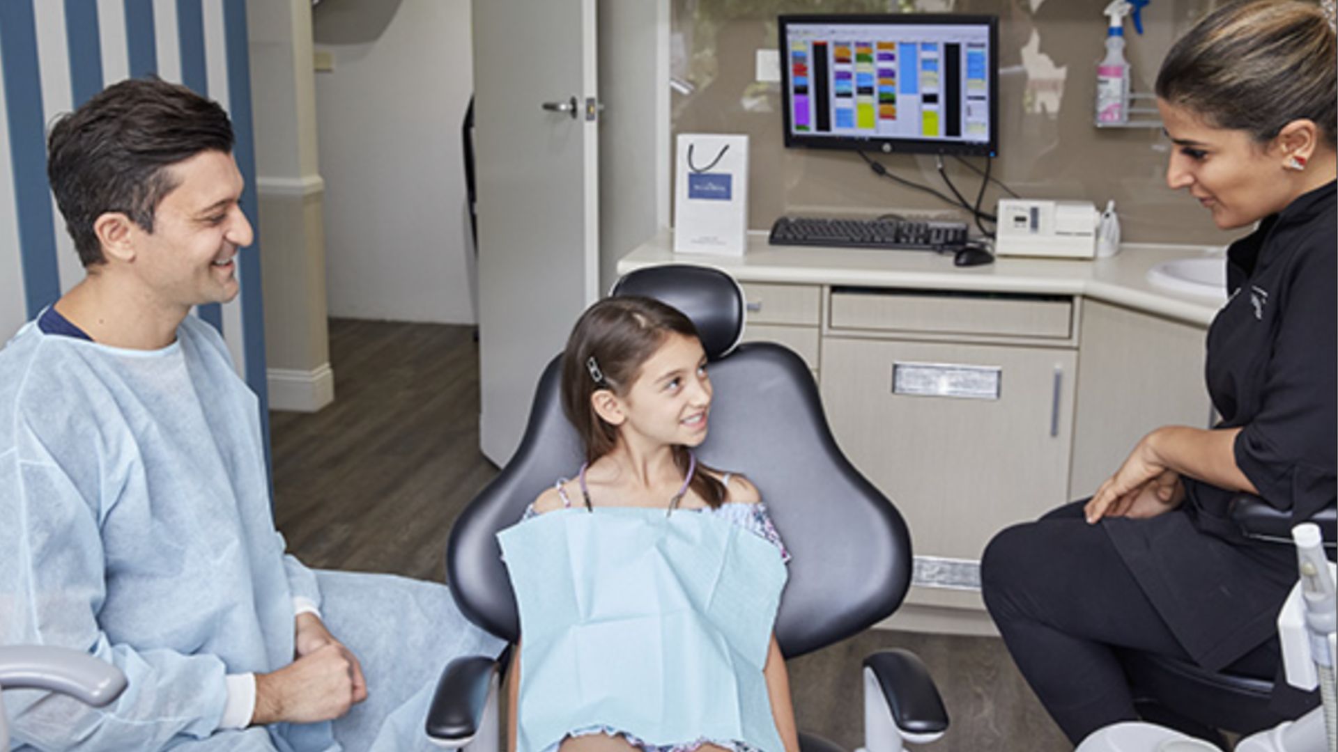 dentist explaining tips to young girl